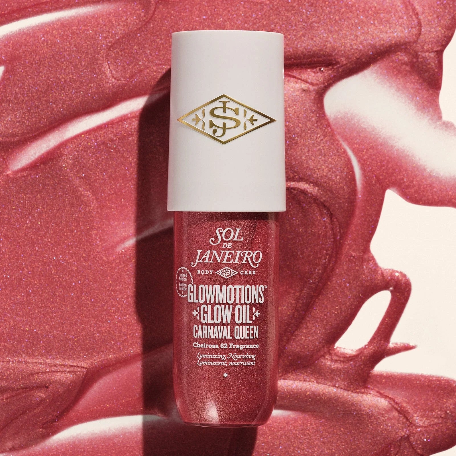 This image is showing sol de janeiro glowmotions body oil carnaval queen shade render. The background is showing the glow oil poured out, goop shot
